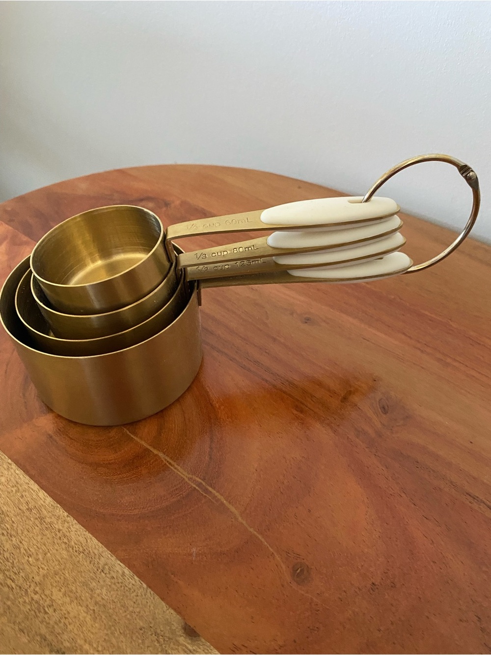 Brass Tone Measuring Cups with Cream Handles - Set of 4